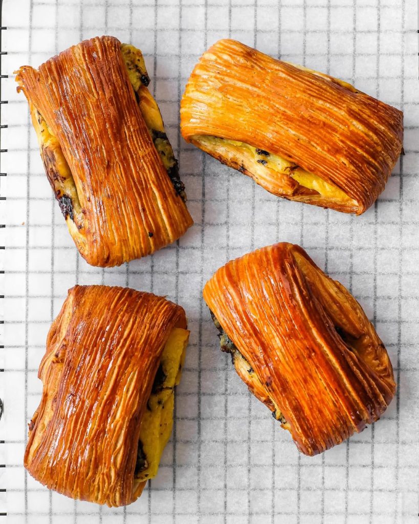 Pain suisse. The perfect combination of flaky pastry, vanilla custard cream & chocolate. #pastry